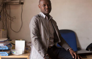 A photo of Peter Njane in his office jpg