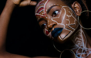 A black girl with face painting on jpg